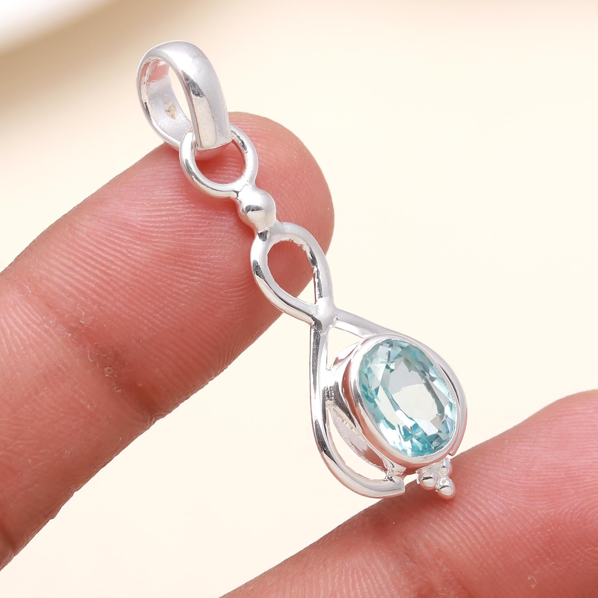The Azure Infinity: Blue Topaz Elegant Loop Pendant