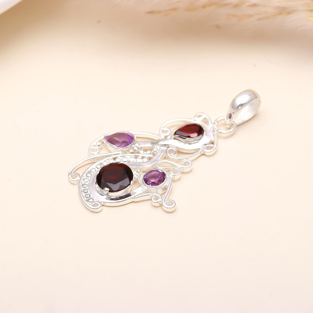 The Mystic Swirl: Garnet & Amethyst Abstract Curve Pendant