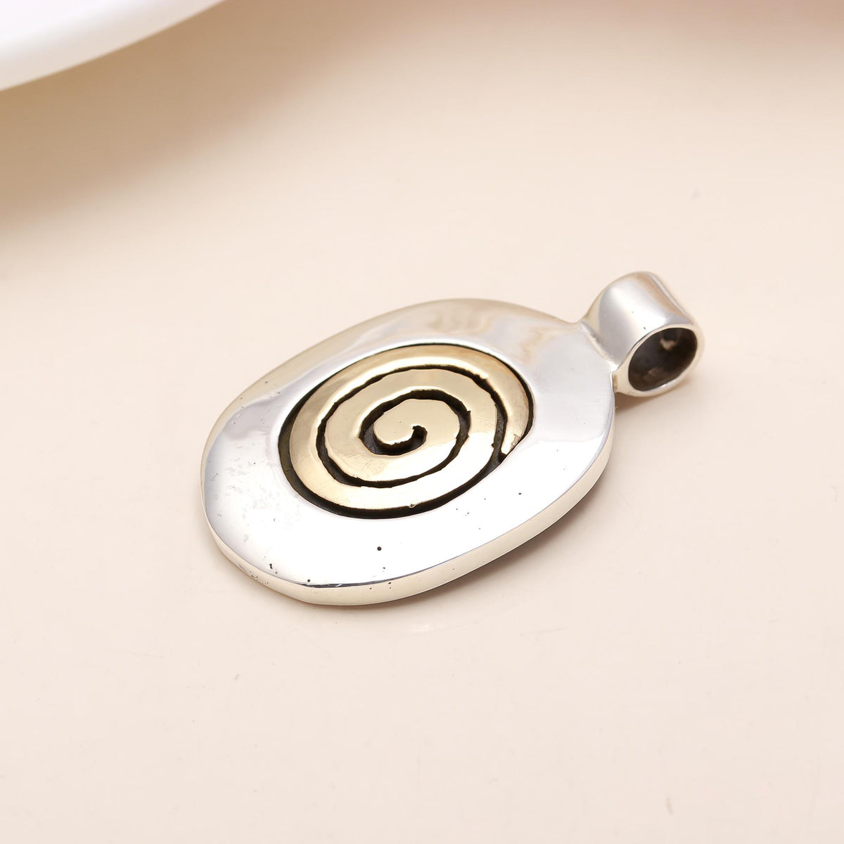 The Golden Spiral: Two-Tone Brass Spiral Oval Silver Pendant