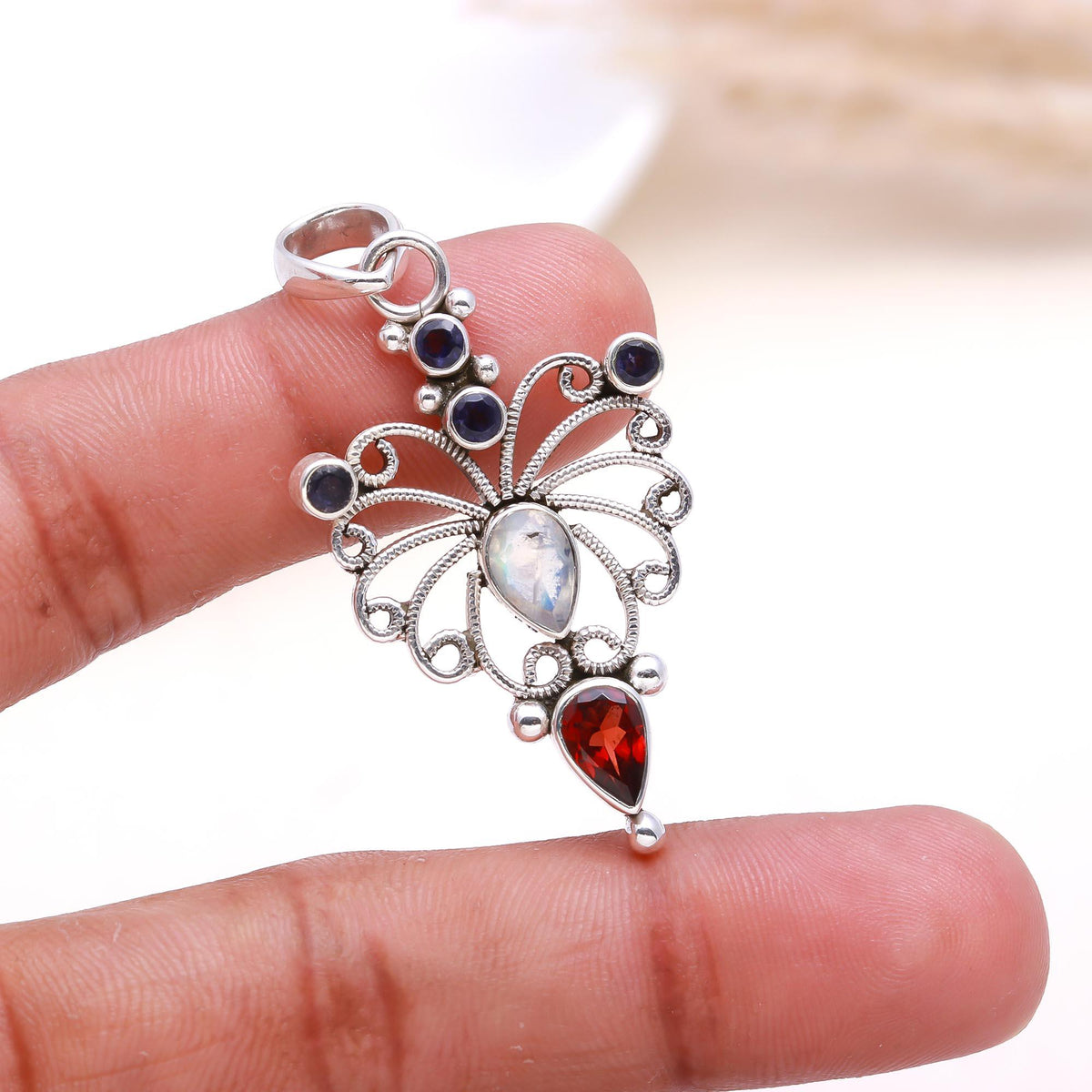 The Celestial Butterfly: Moonstone & Garnet Pendant