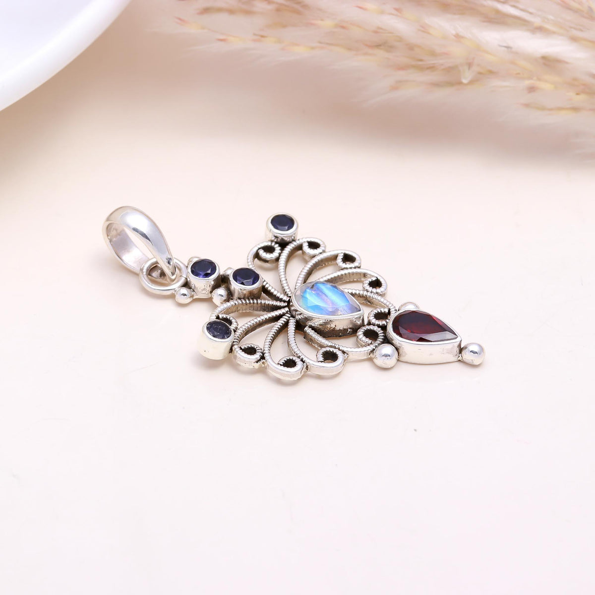 The Celestial Butterfly: Moonstone & Garnet Pendant