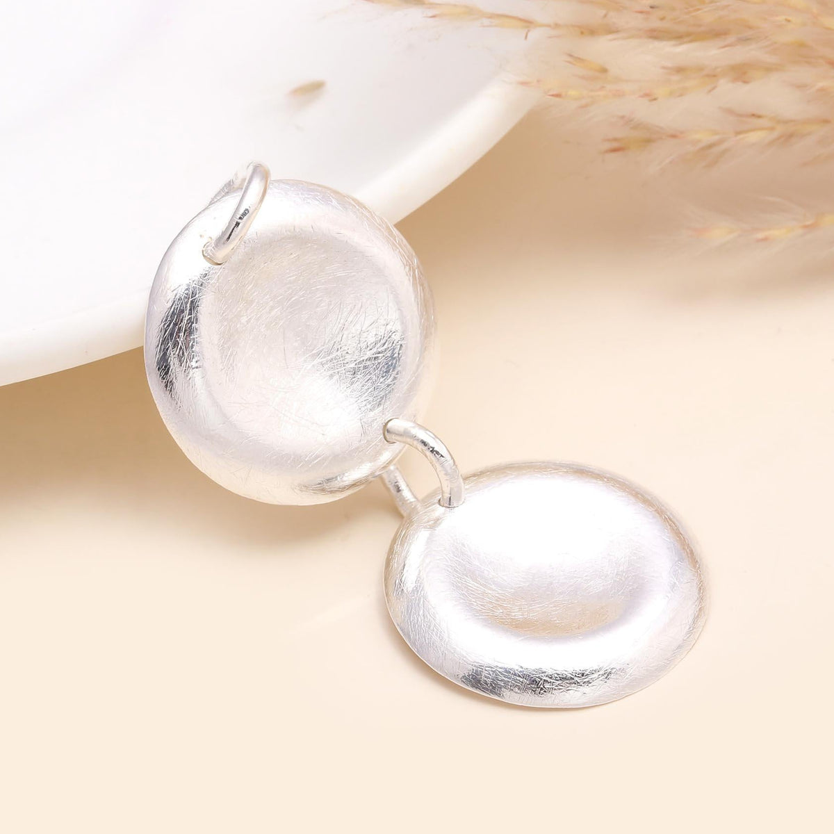 A 925 sterling silver linked circles disc pendant with a polished finish, displayed against a neutral background.