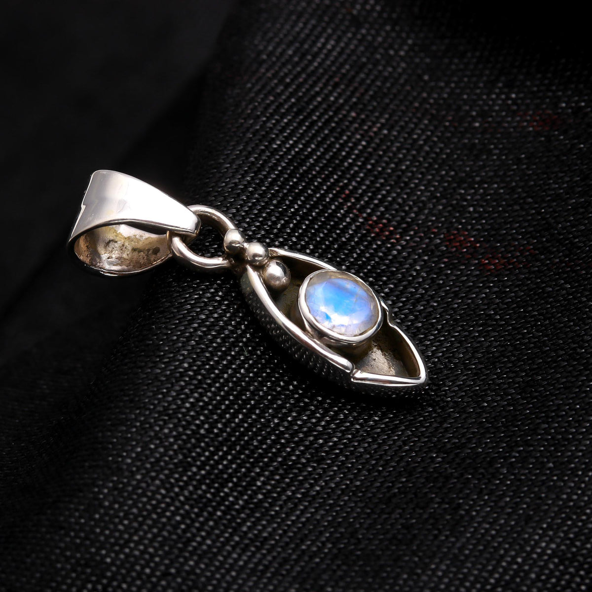 The Moonstone Arc: Minimalist Silver Charm