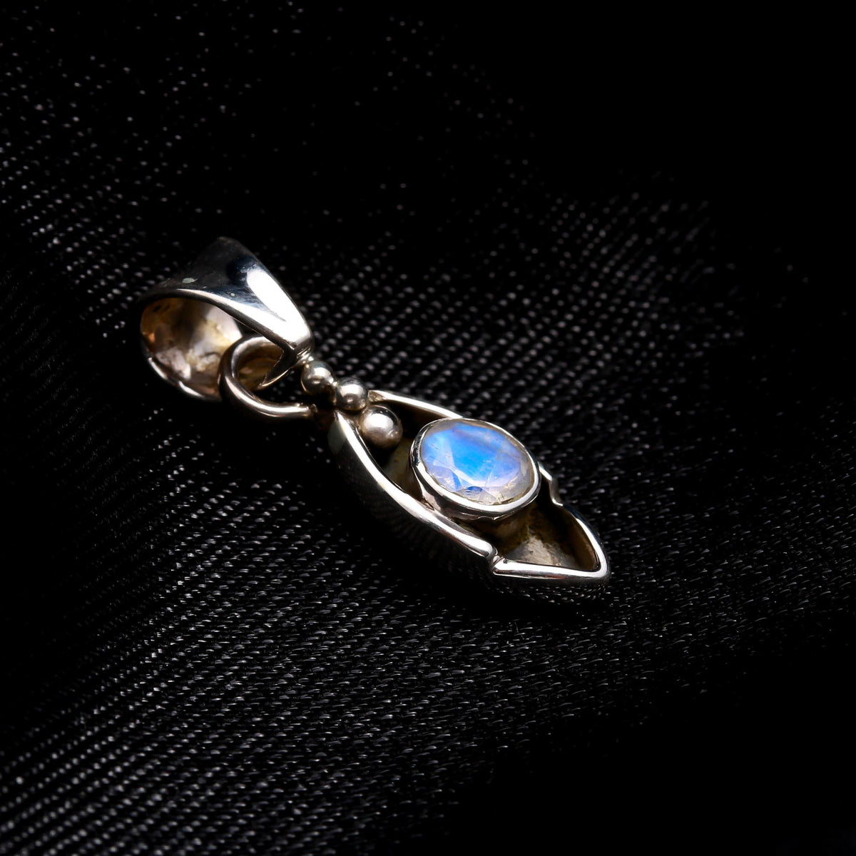 The Moonstone Arc: Minimalist Silver Charm