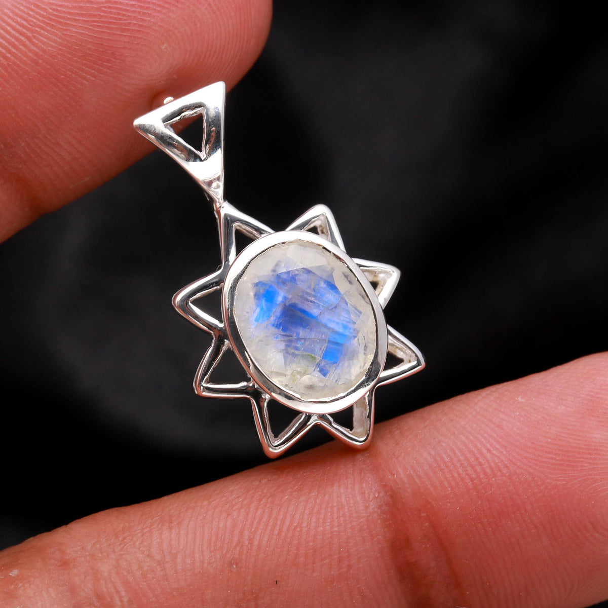 The Flame Star: Radiant Moonstone Silver Starburst Charm