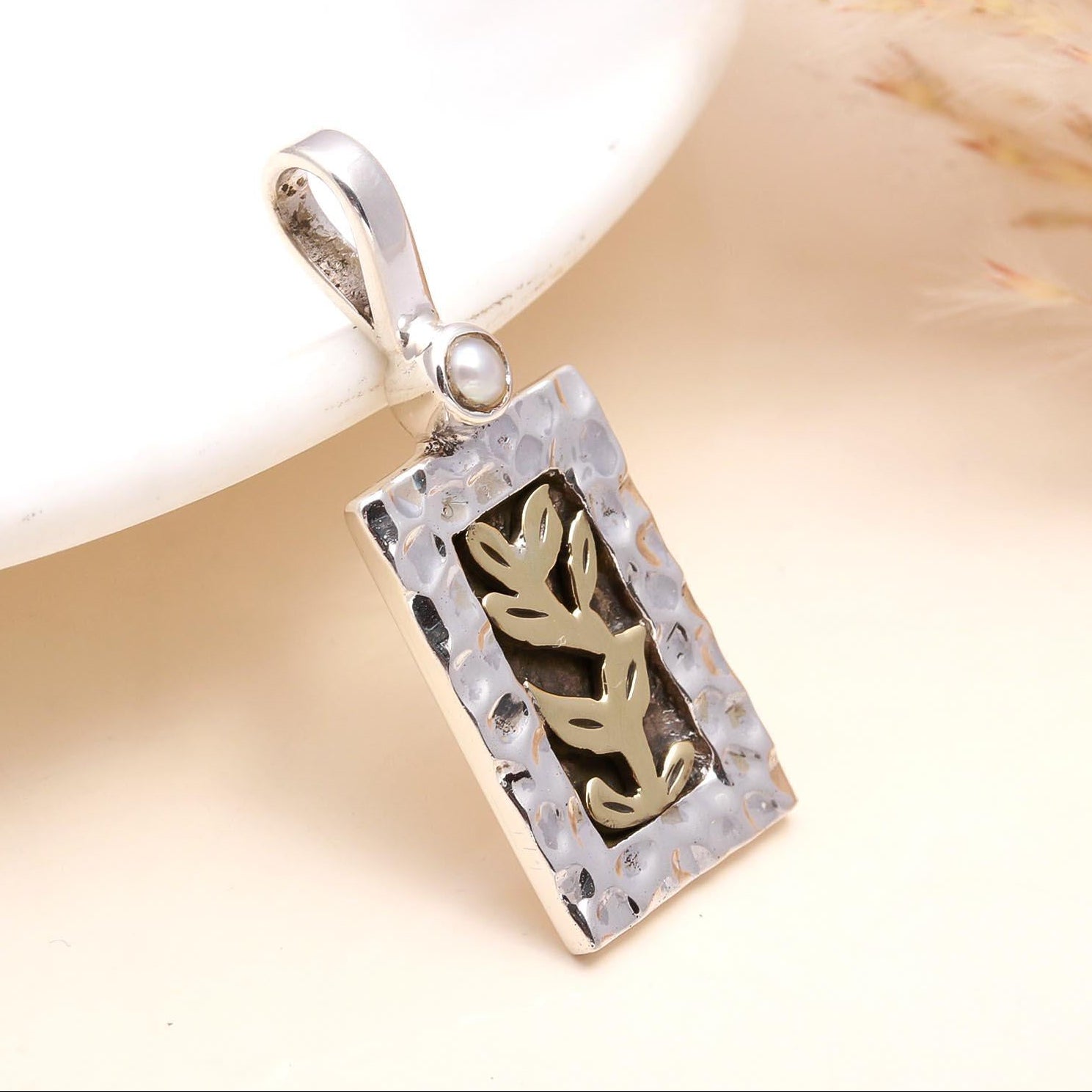 A 925 Sterling Silver Leaf Design Pendant with intricate leaf motif, presented against a neutral background.