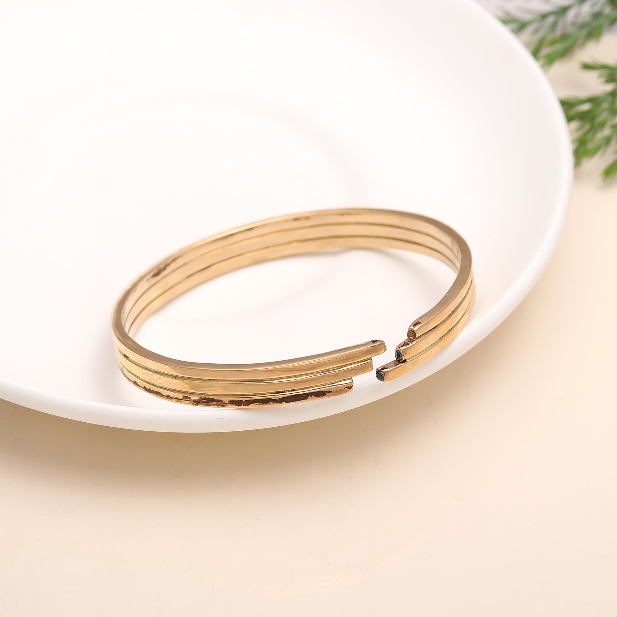 The Tiered Trinity: Triple Band Gold Bangle