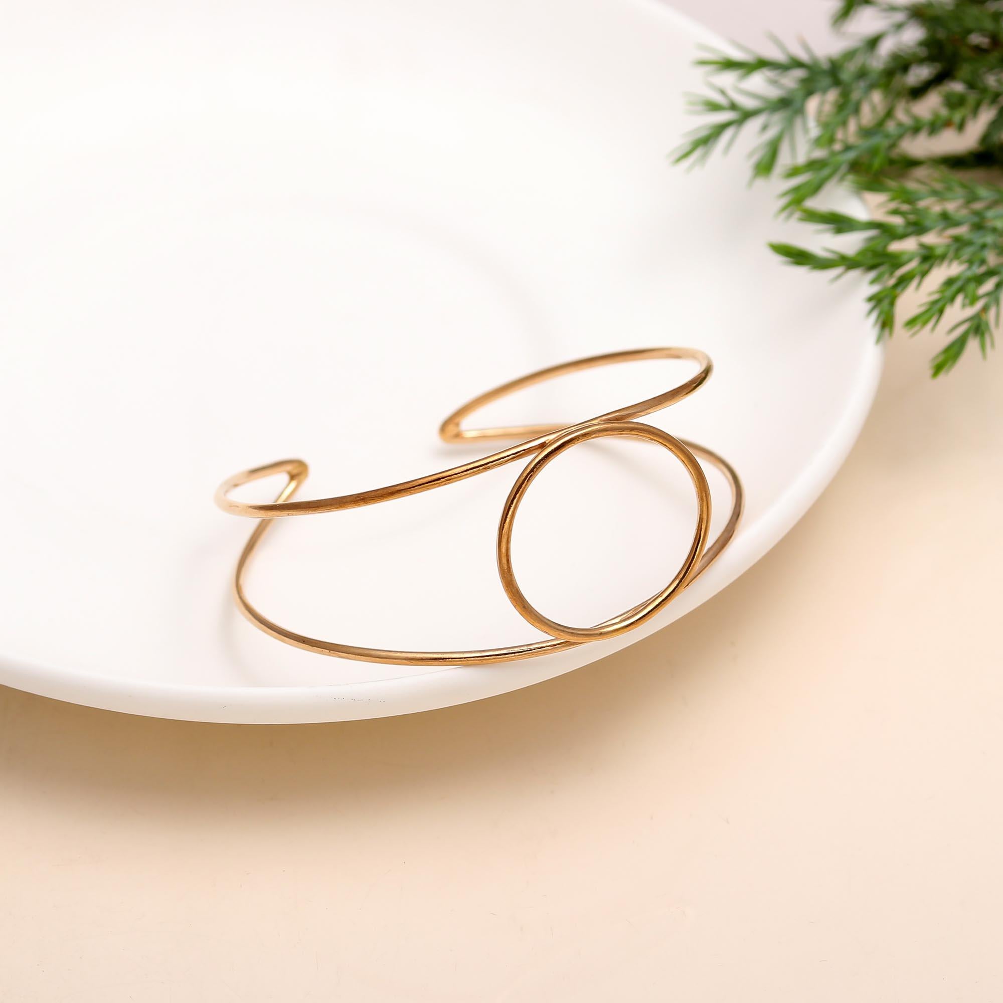 The Halo Horizon: Geometric Gold Circle Cuff