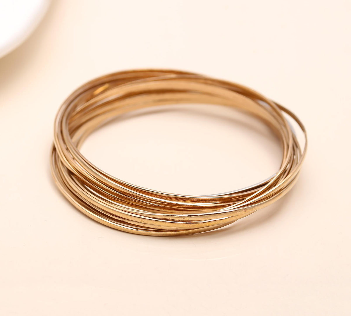 The Gilded Unity: Multi-Strand Gold Interlocking Bangle