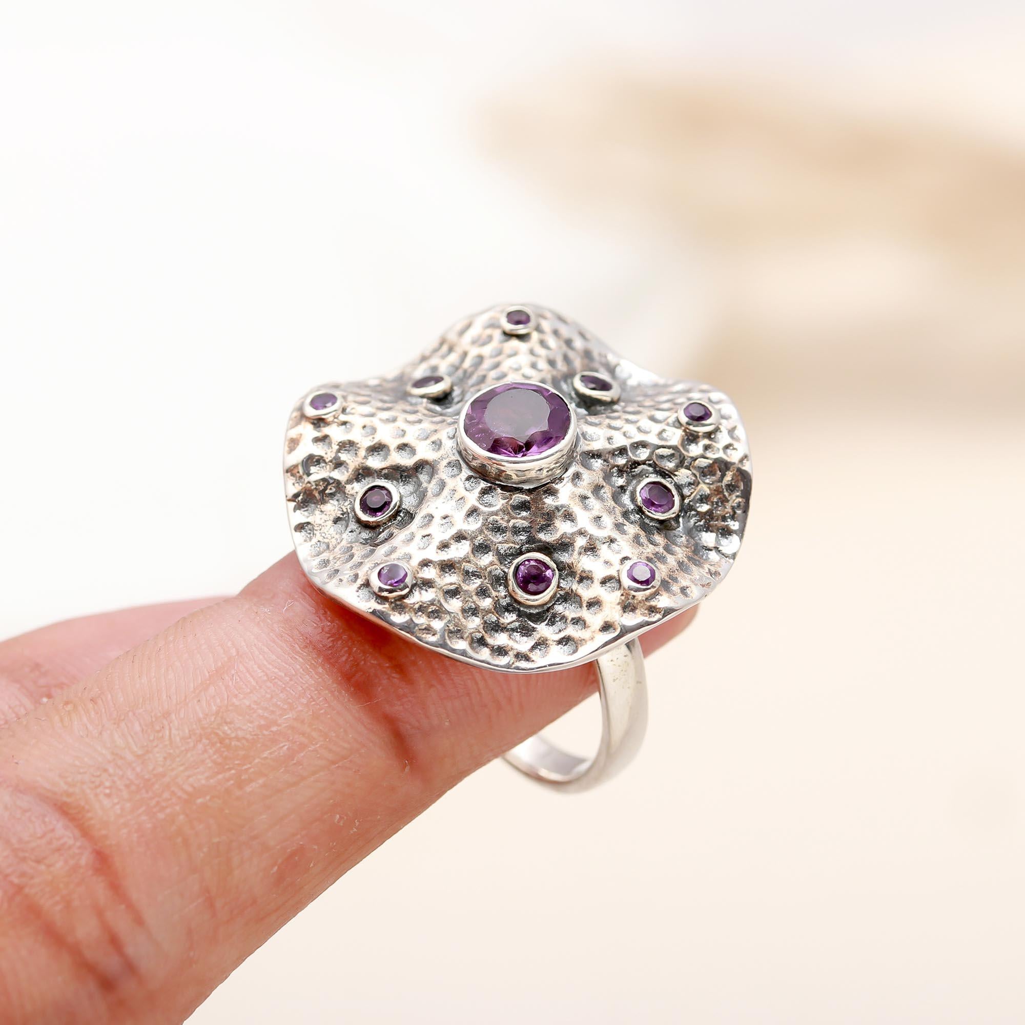 Handcrafted sterling silver dome ring with purple gemstone details