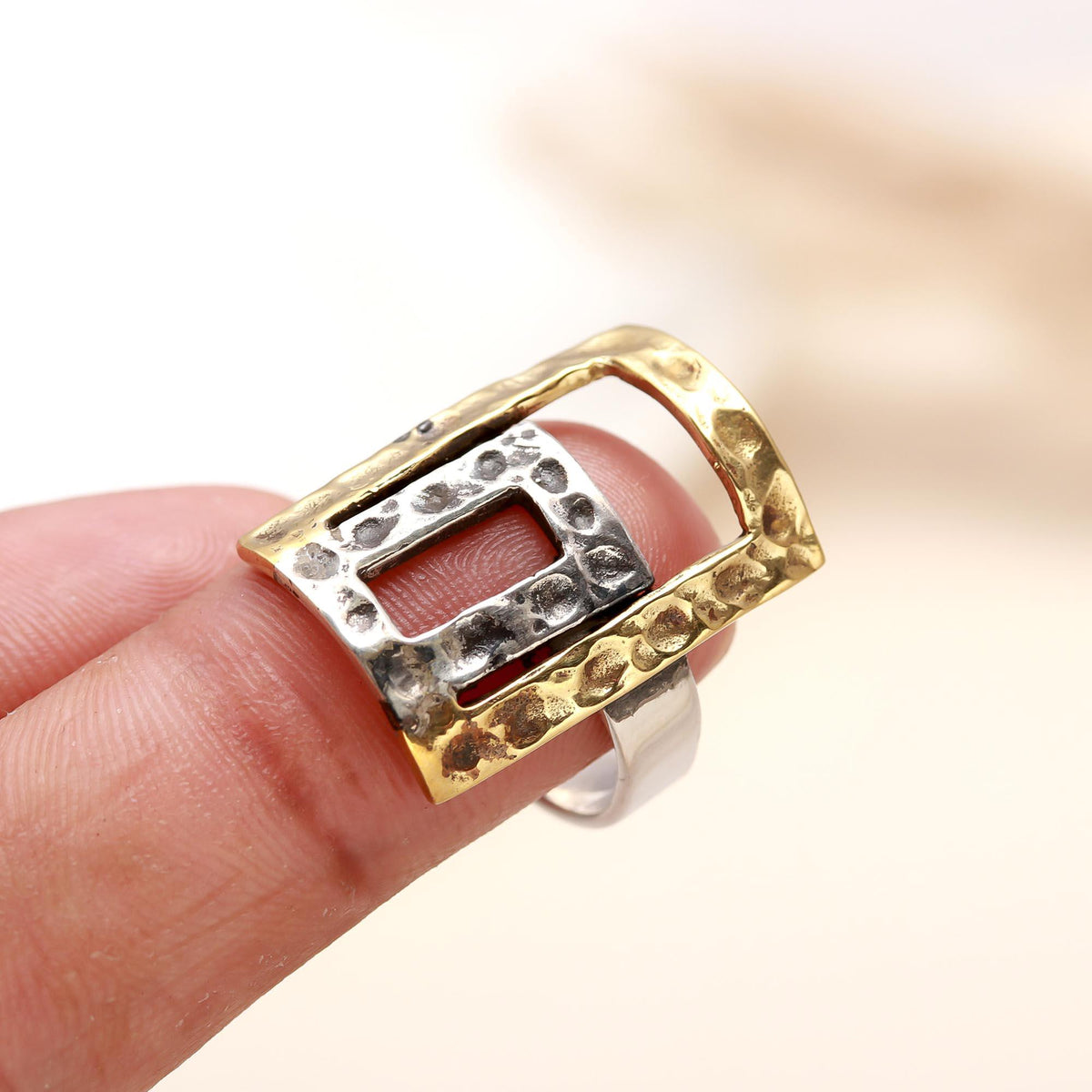 Modern hammered rectangle silver ring with gold accents