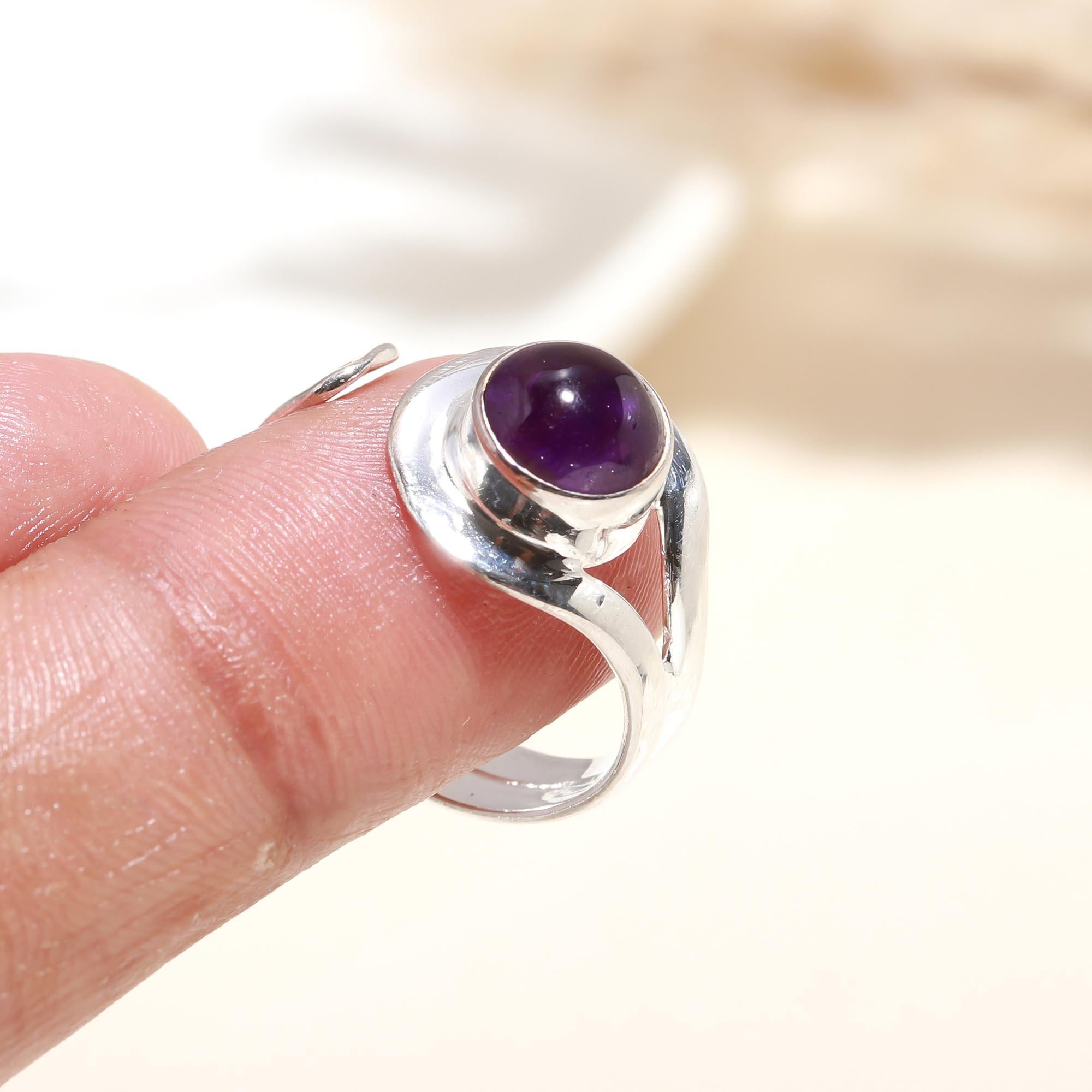 Elegant purple amethyst ring on finger