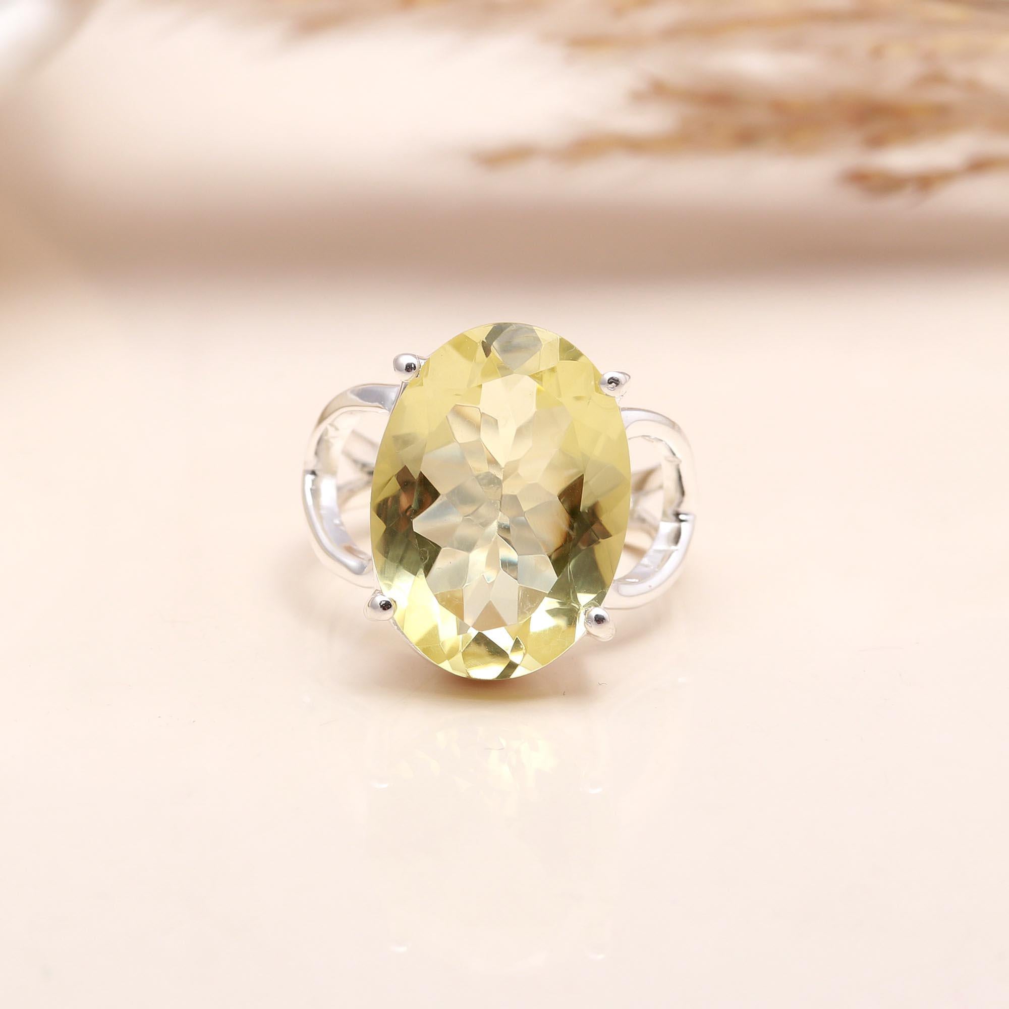 Close-up of oval lemon quartz statement silver ring