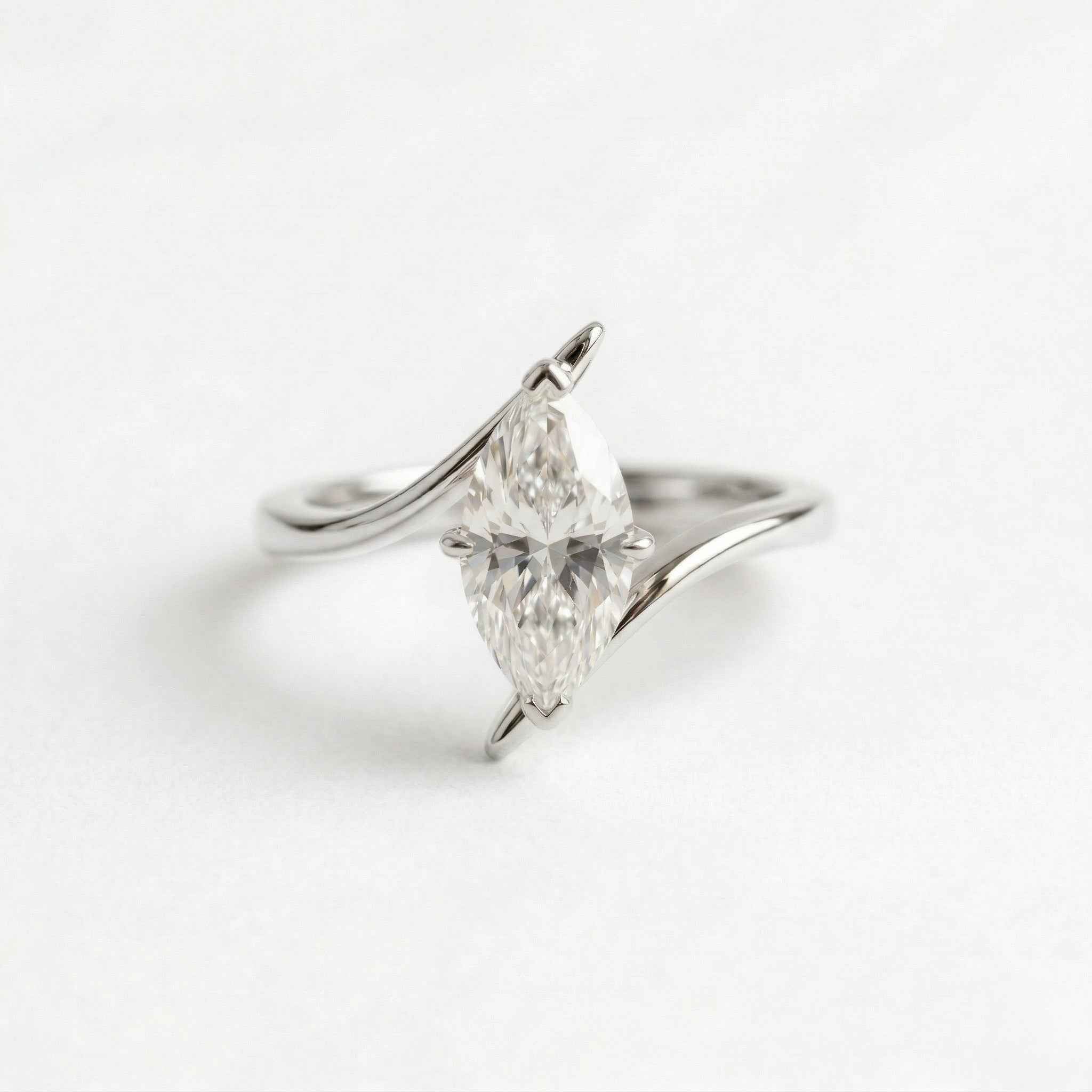 The Marquise Wave: Solitaire Moissanite Bypass Engagement Ring