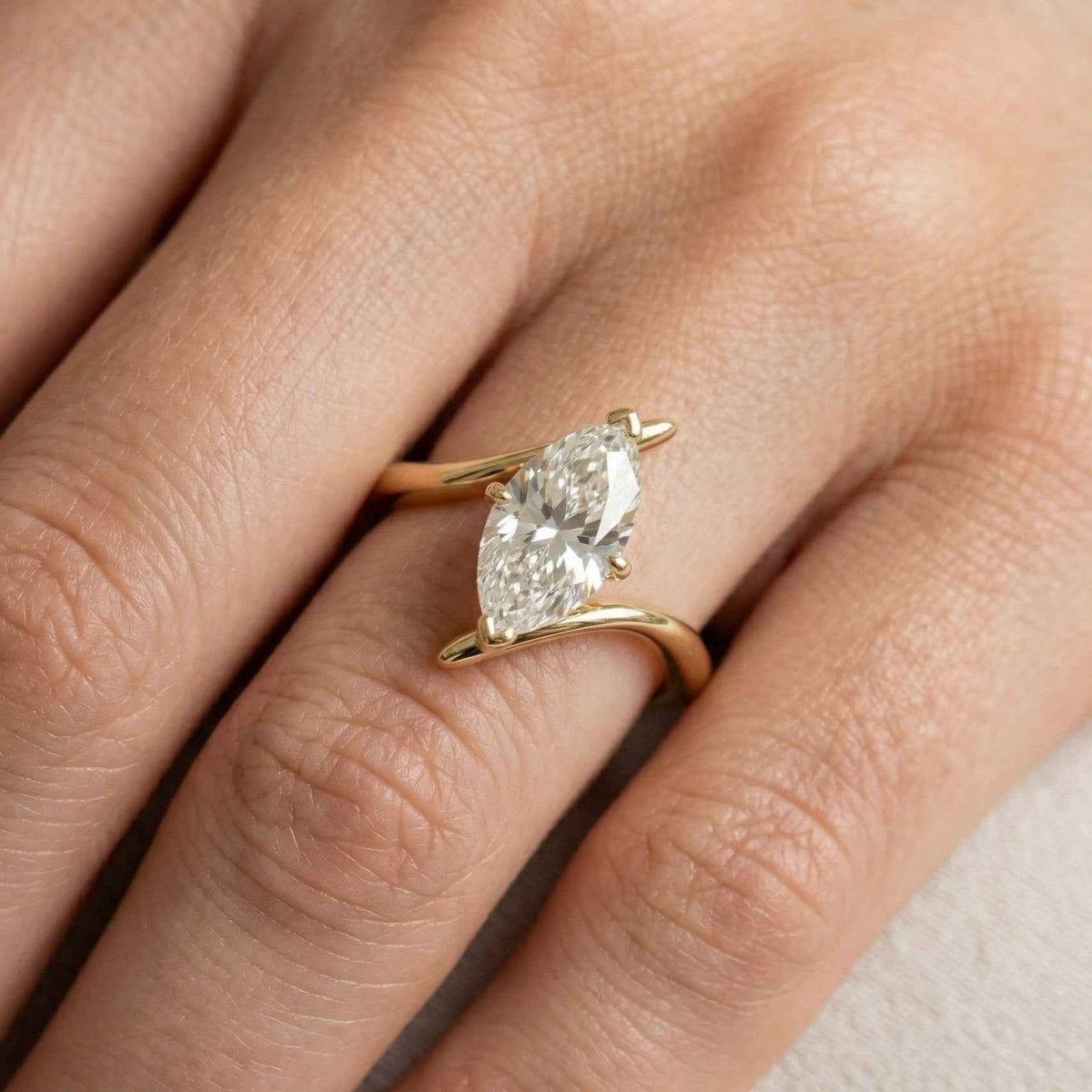 The Marquise Wave: Solitaire Moissanite Bypass Engagement Ring