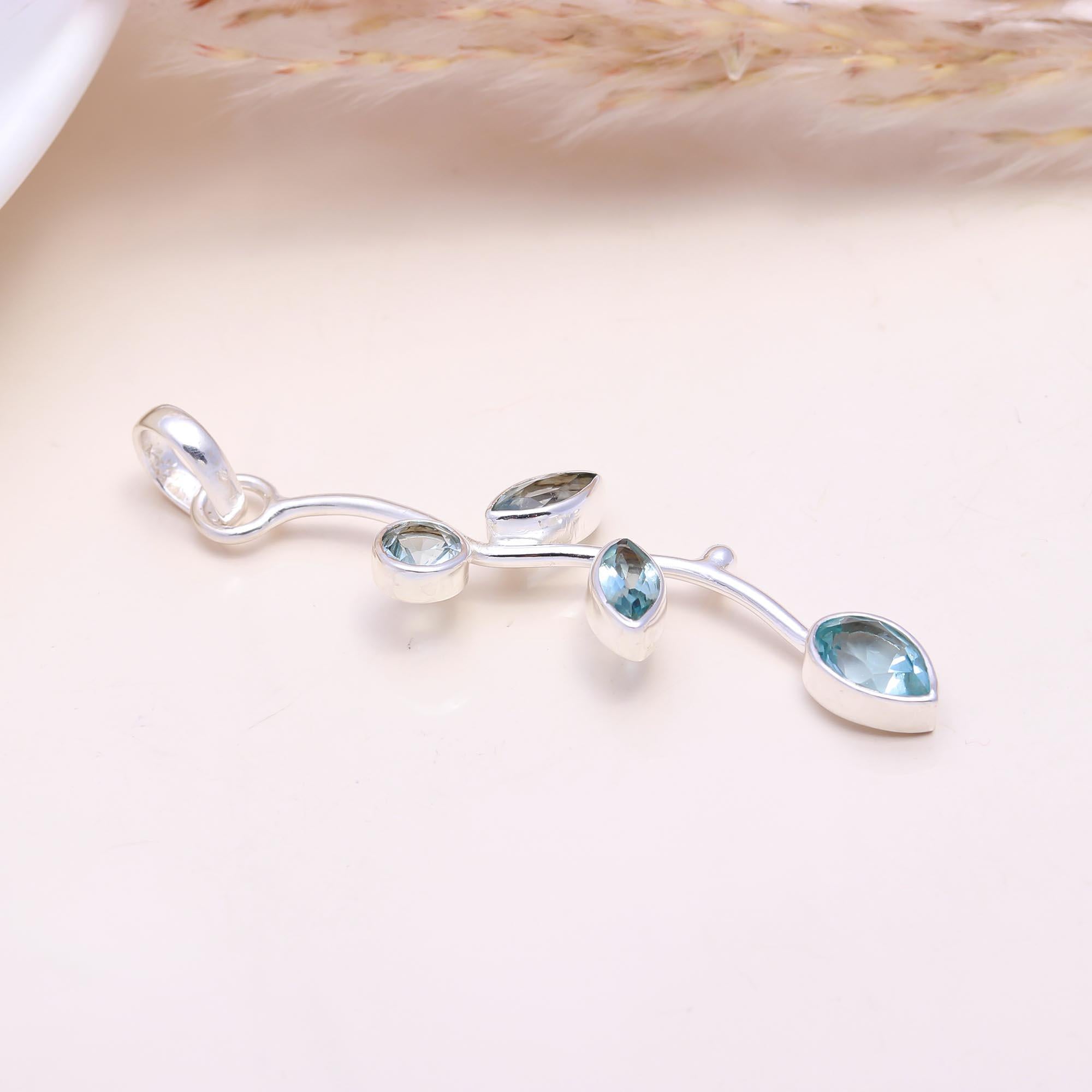 The Nature's Path: Blue Topaz Leaf Branch Pendant