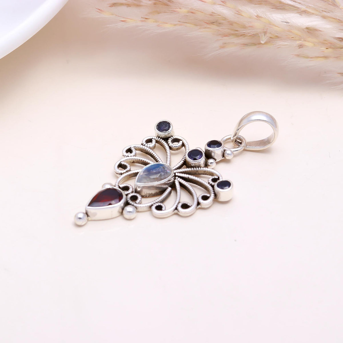The Celestial Butterfly: Moonstone & Garnet Pendant
