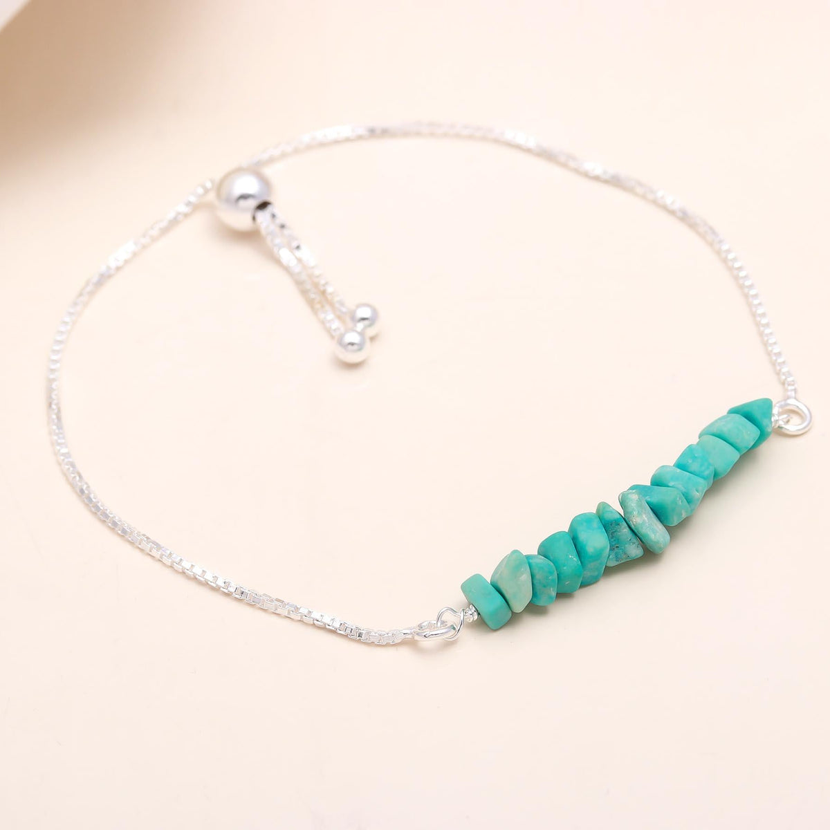 Turquoise beaded bracelet on a white background