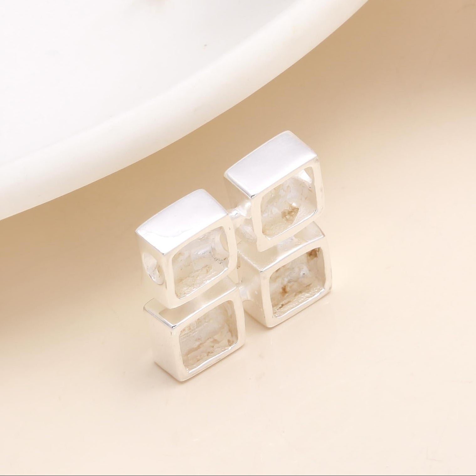 A 925 sterling silver pendant with four square natural stones set in a quad layout on a white background.