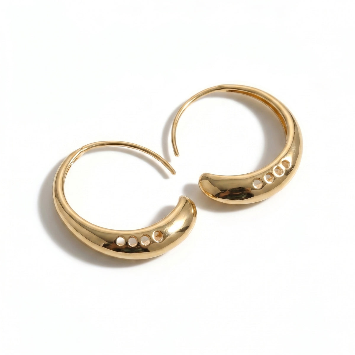 Pair of gold hoop earrings on a white background