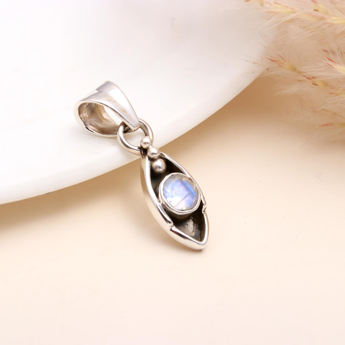 The Moonstone Arc: Minimalist Silver Charm
