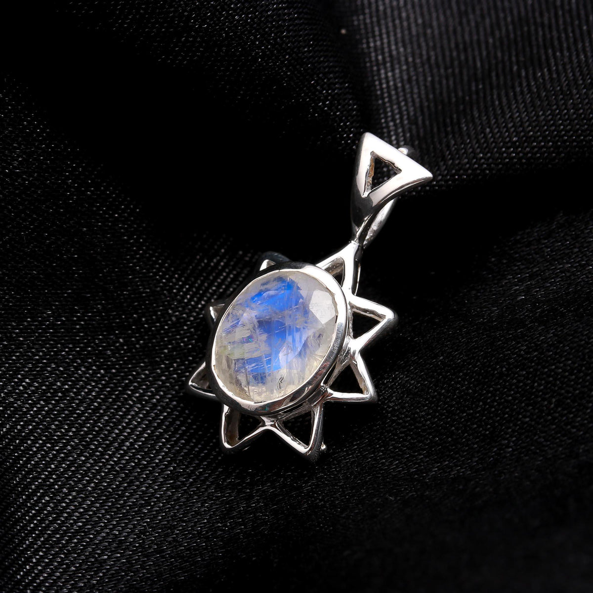 The Flame Star: Radiant Moonstone Silver Starburst Charm