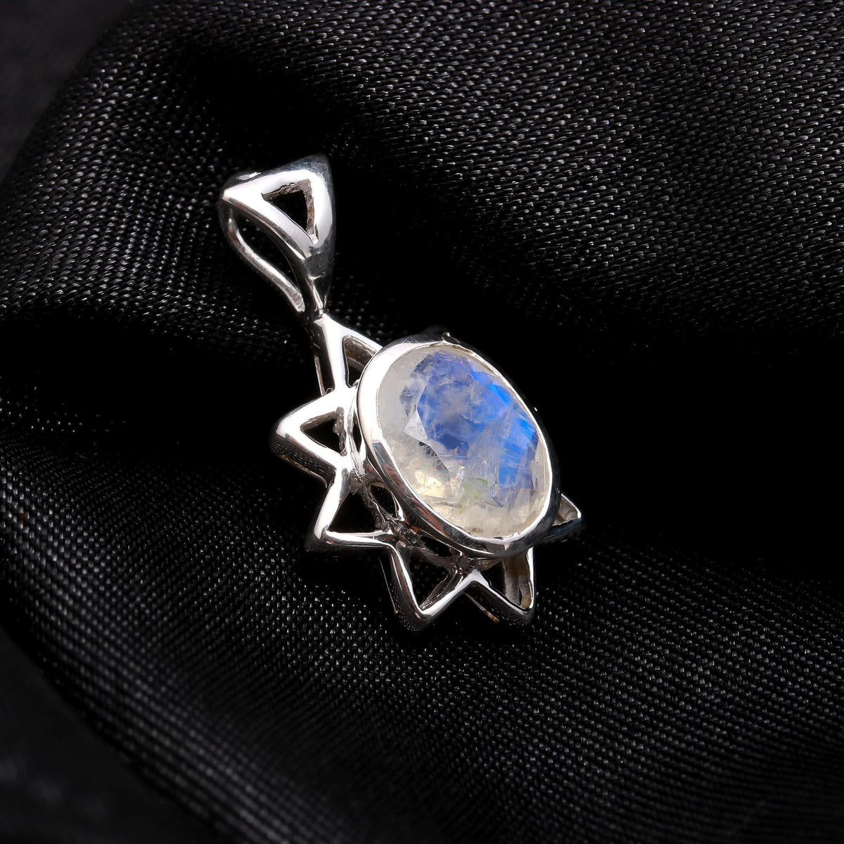 The Flame Star: Radiant Moonstone Silver Starburst Charm