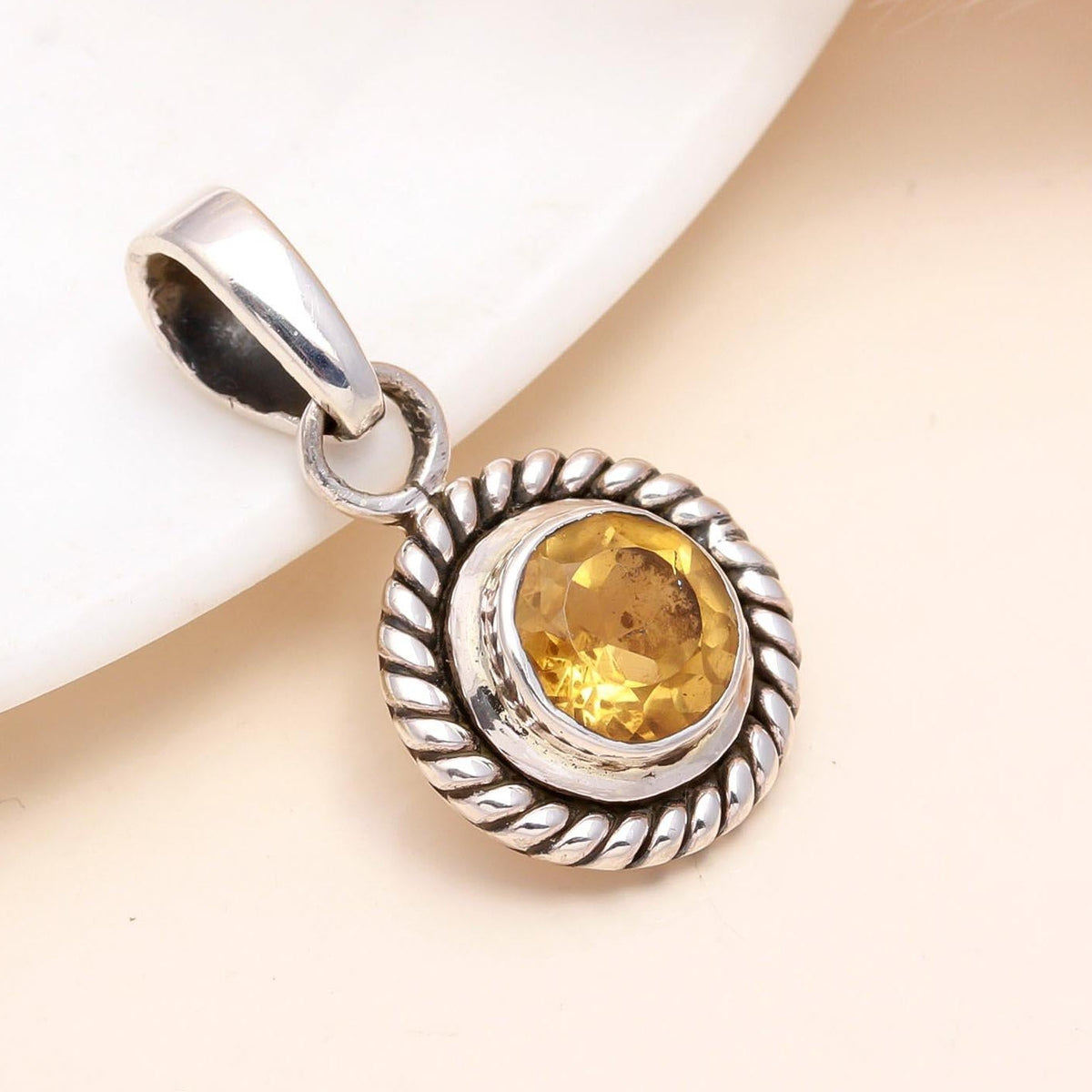 A 925 Sterling Silver pendant featuring a vintage-style twisted rope design with a natural citrine gemstone at its center, displayed against a neutral background.