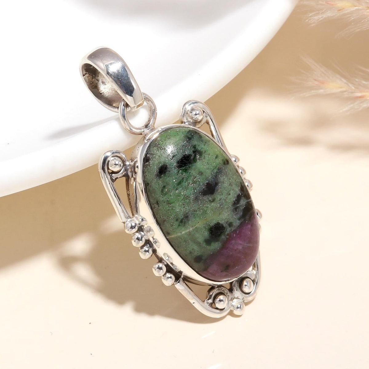 A 925 Sterling Silver handmade Ruby Zoisite pendant with a boho style, displayed against a neutral background.