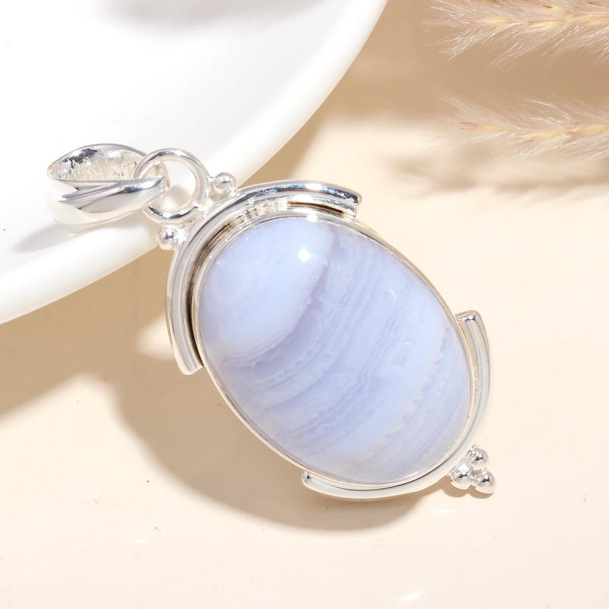 A 925 Sterling Silver Oval Blue Lace Agate Pendant with a handmade boho design, displayed against a neutral background.