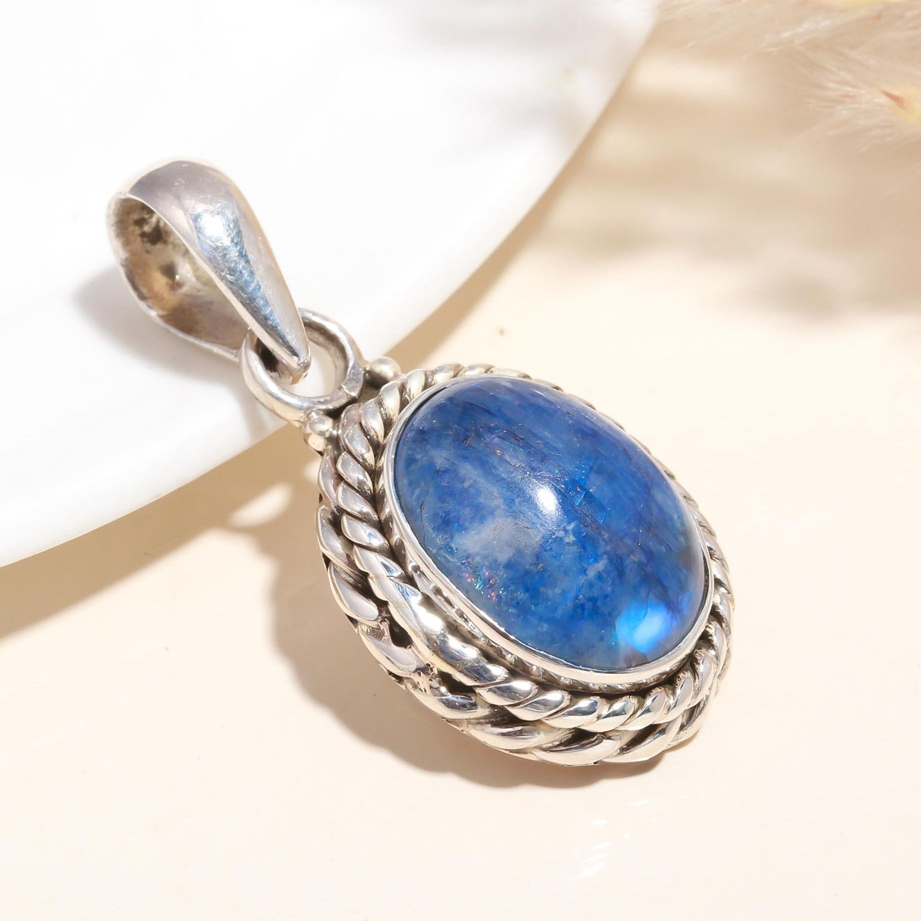 A 925 Sterling Silver Blue Kyanite Pendant with intricate silver detailing, displayed against a neutral background.