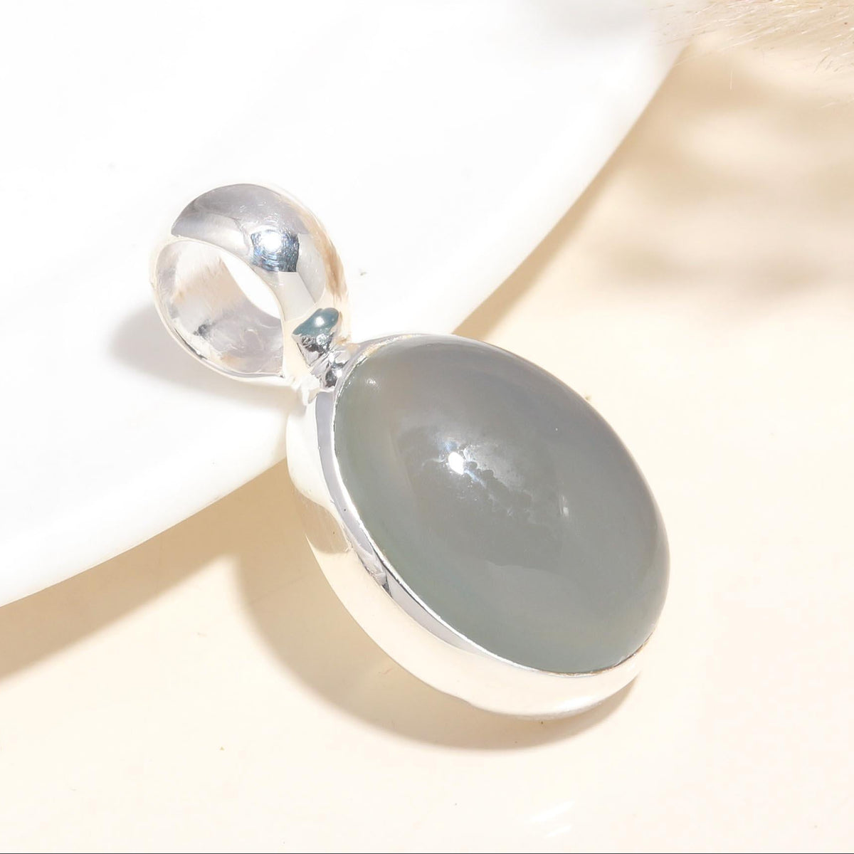 A 925 Sterling Silver Grey Moonstone Pendant with a handmade boho design, displayed against a neutral background.