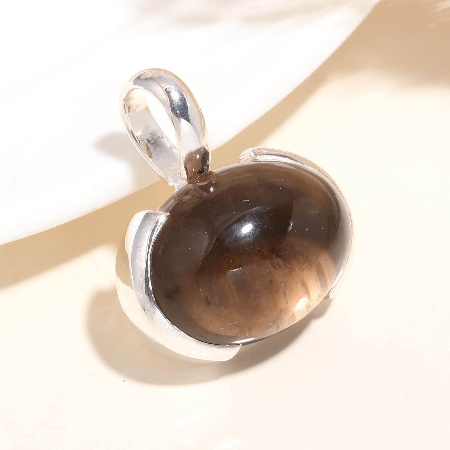 A 925 Sterling Silver Smoky Quartz Pendant with a handmade boho necklace.