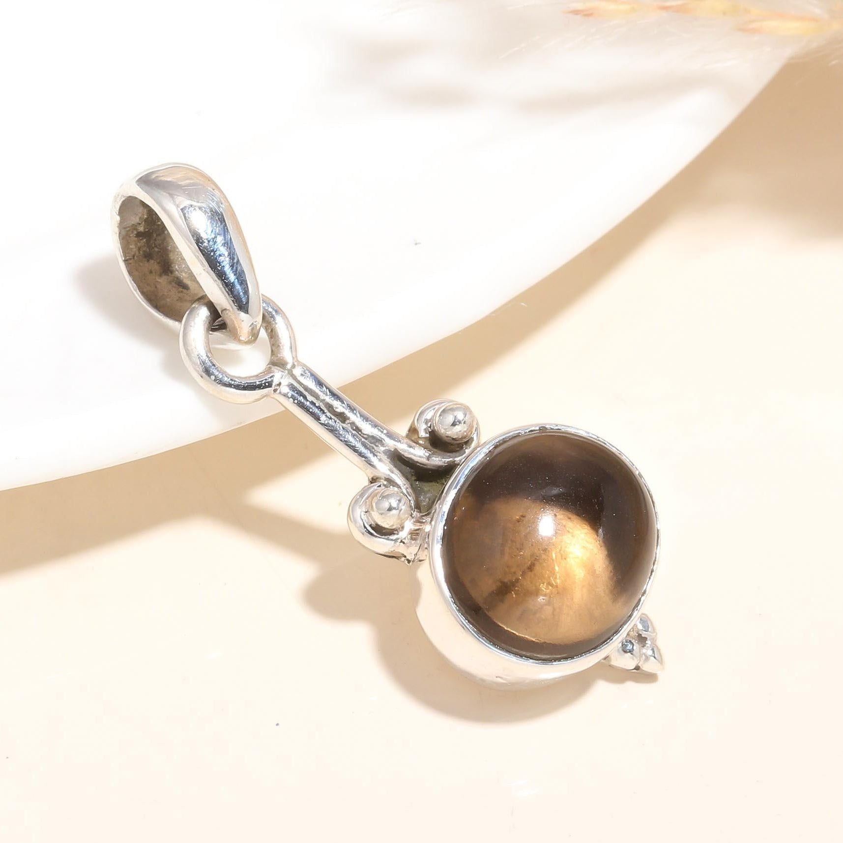 A 925 Sterling Silver pendant with a natural Tiger's Eye gemstone, featuring a handmade boho-inspired design.