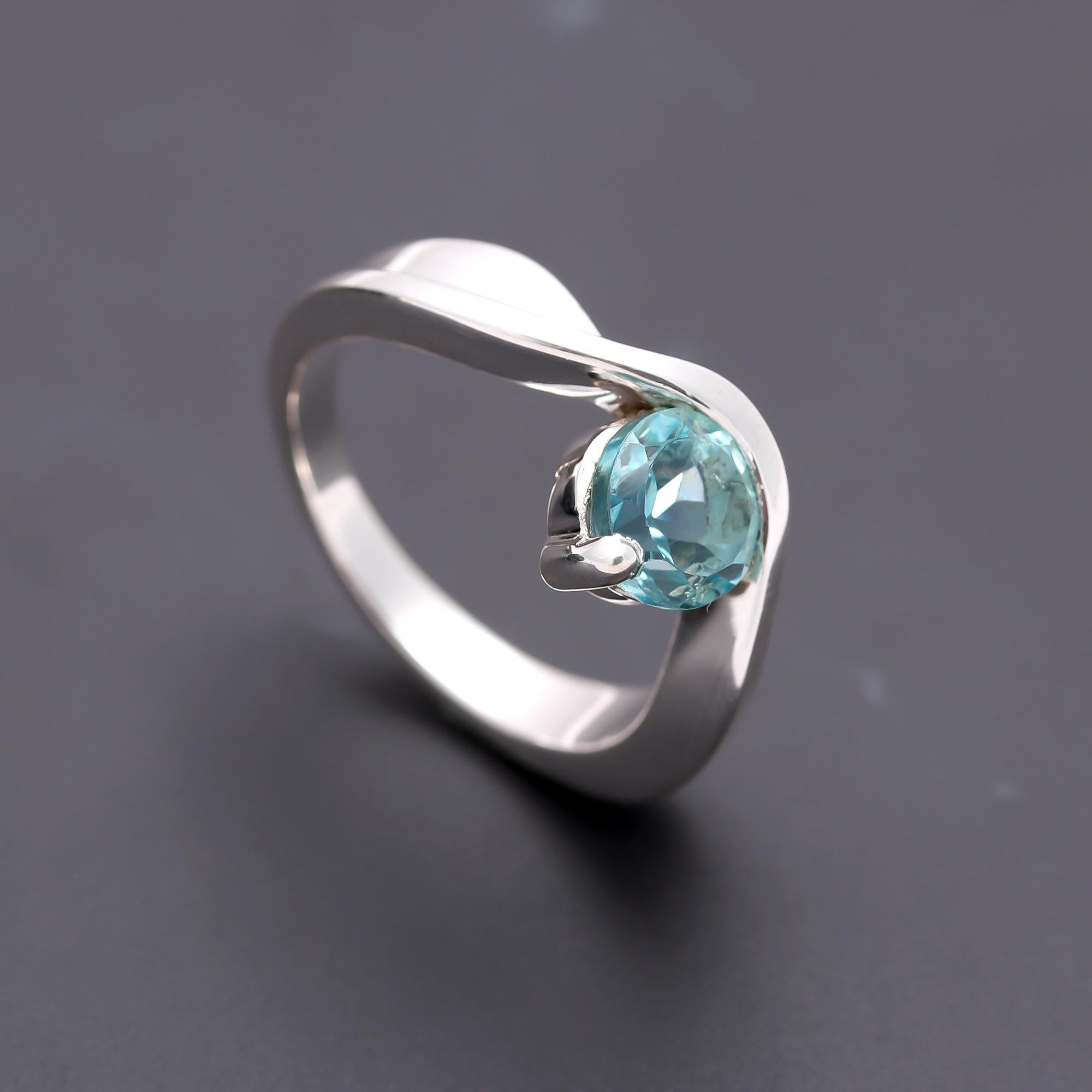 The Azure Swirl: Blue Topaz & Silver Bypass Ring