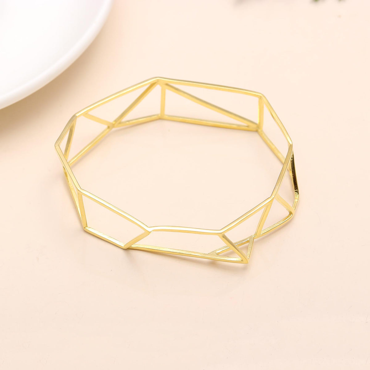 The Faceted Framework: Geometric Gold Bangle