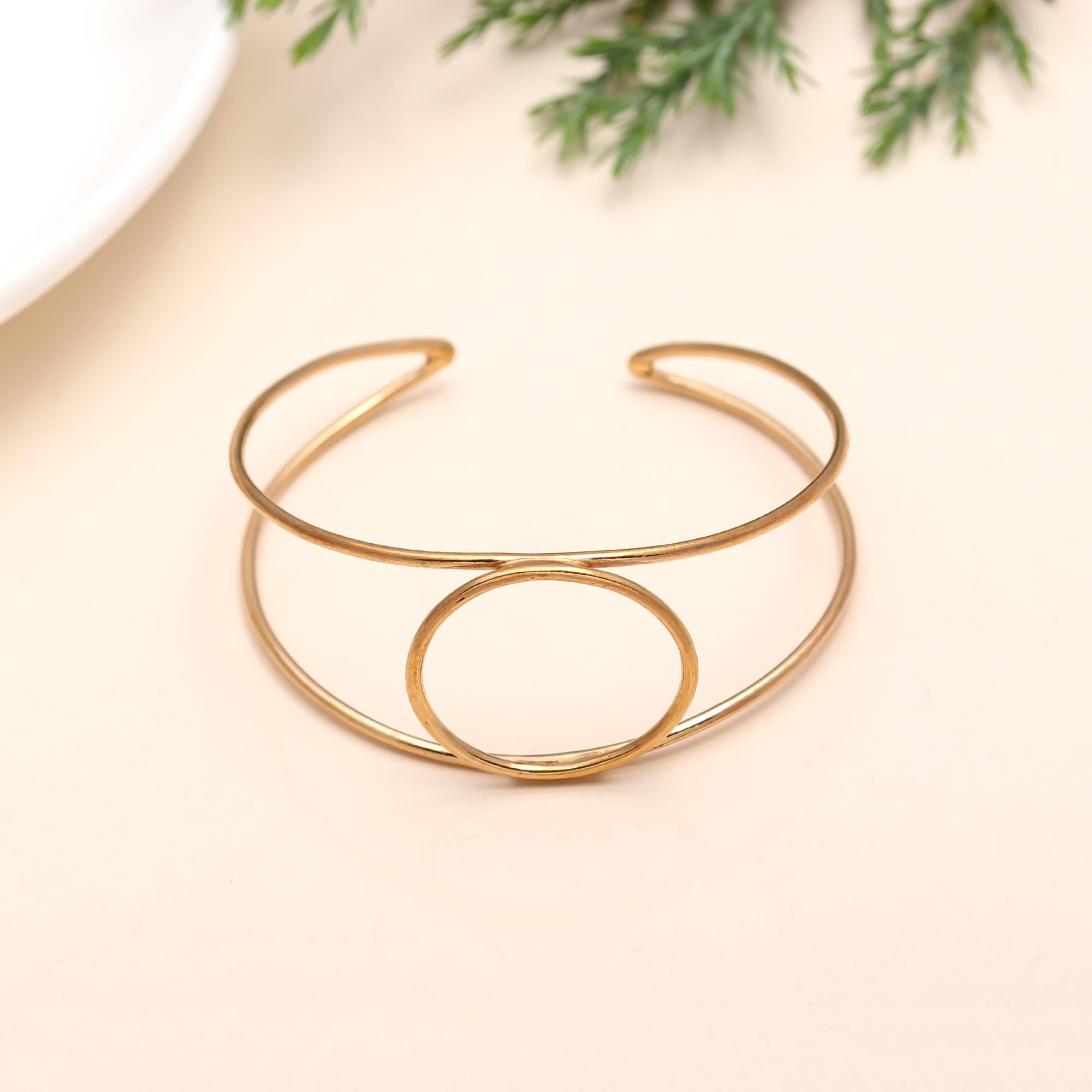 The Halo Horizon: Geometric Gold Circle Cuff