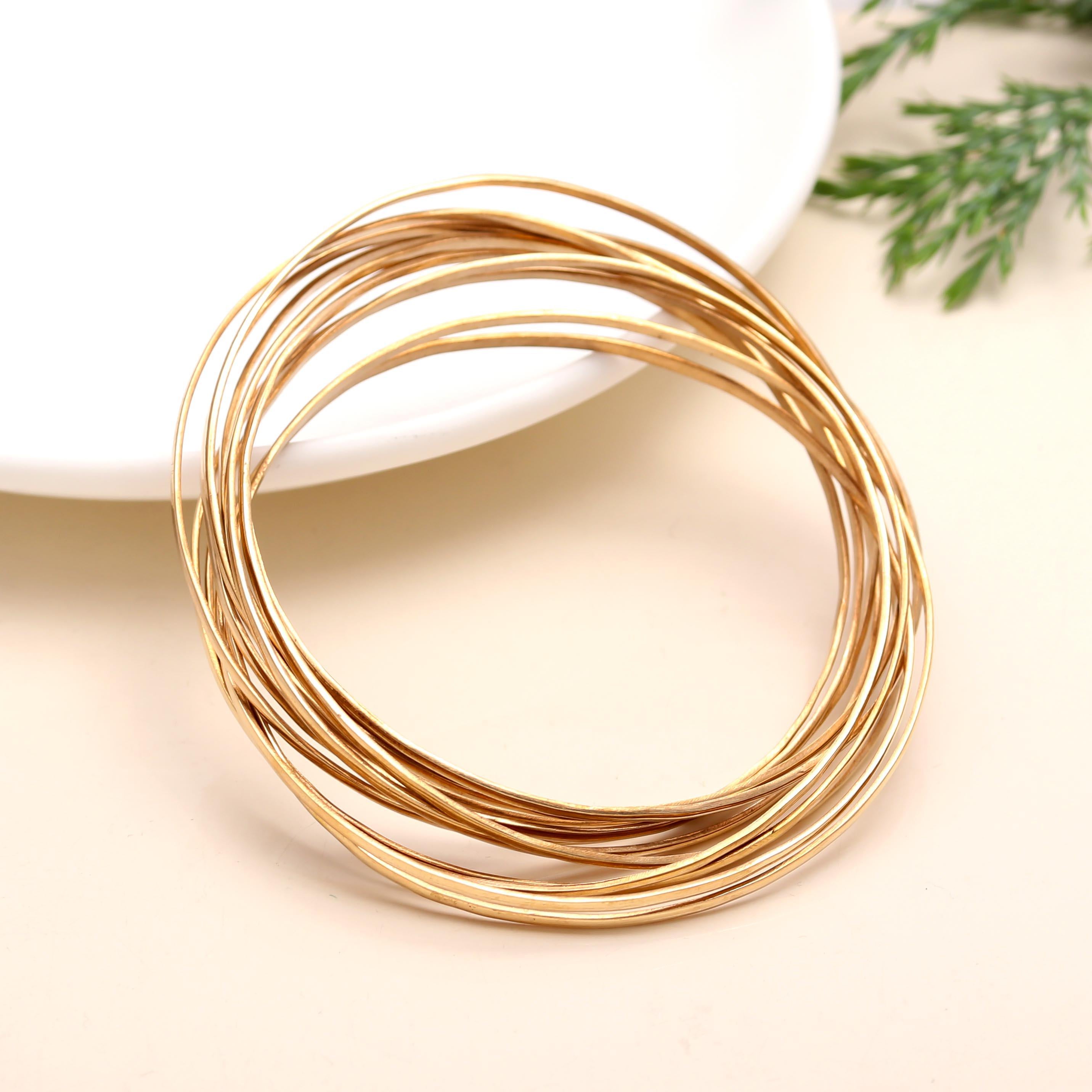 The Golden Cascade: Multi-Strand Gold Bangle Set