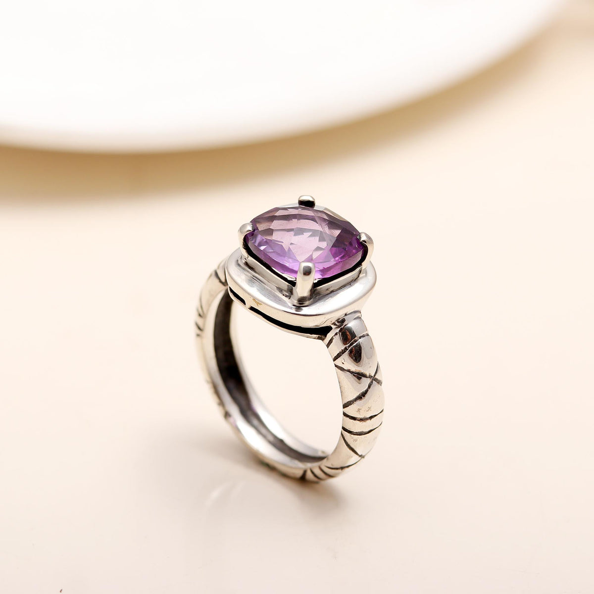 Engraved sterling silver band with cushion-cut amethyst