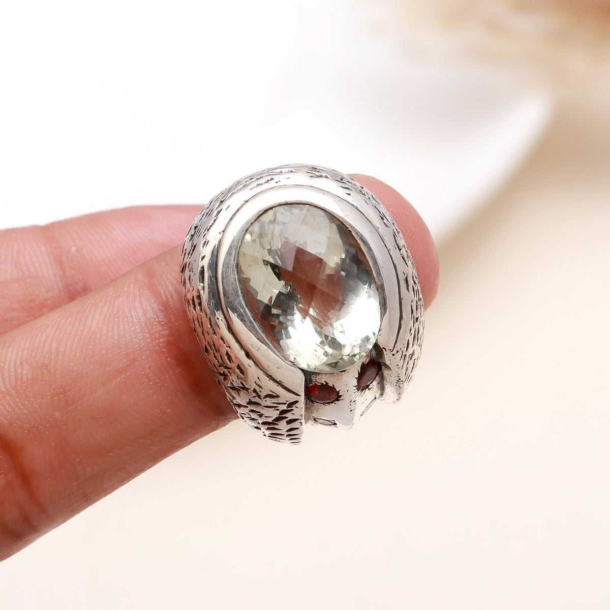Statement green gemstone ring displayed on Finger