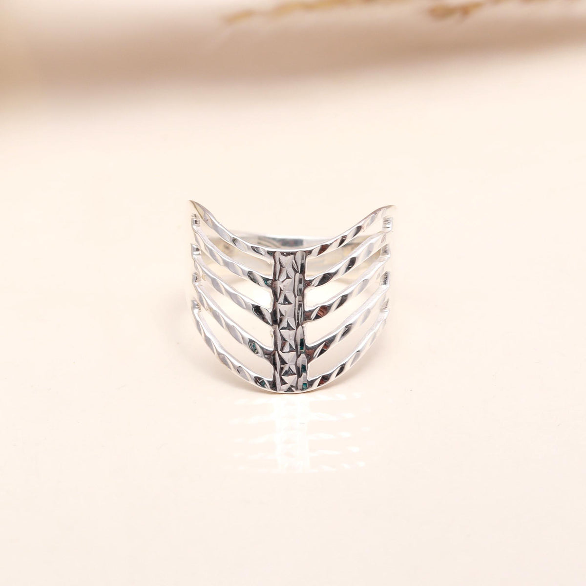 Close-up of textured openwork sterling silver ring